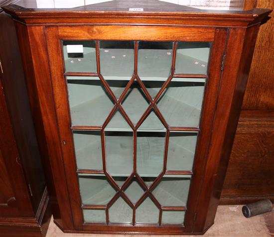 A hanging single door George III period mahogany eighteen panelled glazed corner cabinet(-)